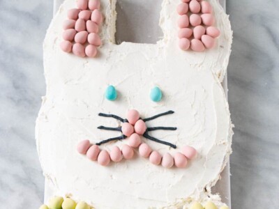 Easter Bunny Cake with Mini Egg ears, nose, and bow tie.