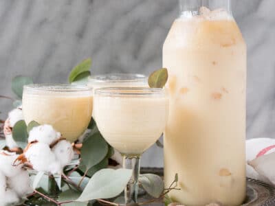 Easy Bourbon Eggnog takes the classic eggnog cocktail and adds the right level of spice and warmth. Top with nutmeg and cinnamon for an indulgent and festive cocktail! #eggnog #cocktail