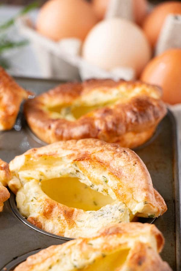 Herbed Yorkshire Pudding in muffin tins with eggs.