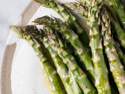 Roasted asparagus on a white plate